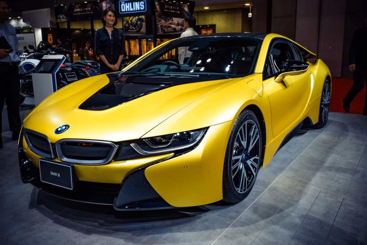 A yellow BMW i8.