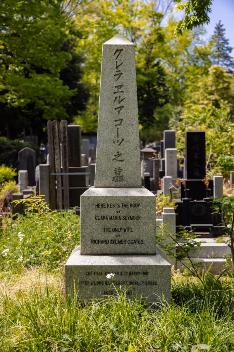 The tall tombstone of Clara Maria Seymour sits in a grassy area.