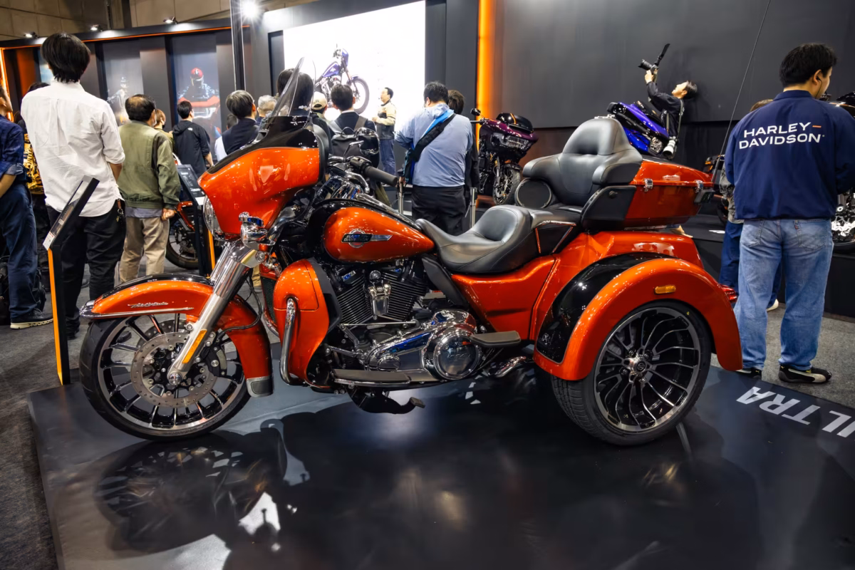 A Harley Davidon trike at a trade show.