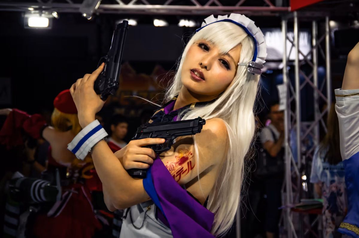 A female cosplayer dressed a maid assassin at a gaming event.