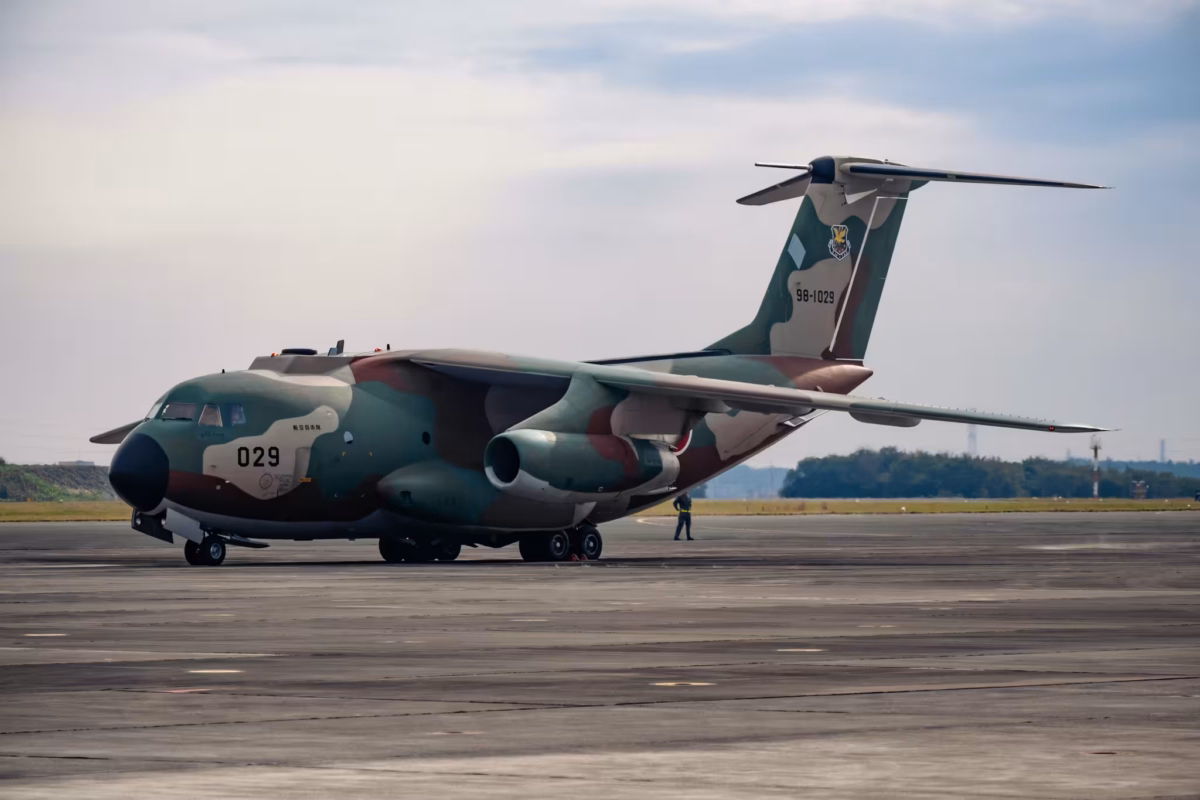 A Kawasaki C1 transport aircrafts sits on a tarmac.