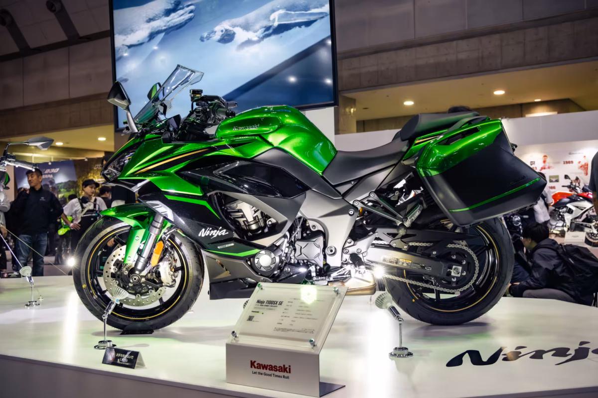 A Kawasaki Ninja 100SX SE at a trade show.