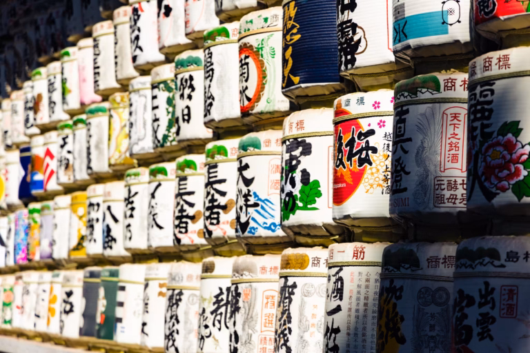 Stacked sake barrels from various brewers at Meiji Shrine.