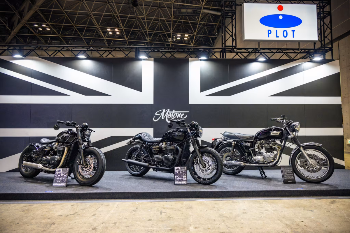 3 Motone motorbikes in front of a Union Jack mural.