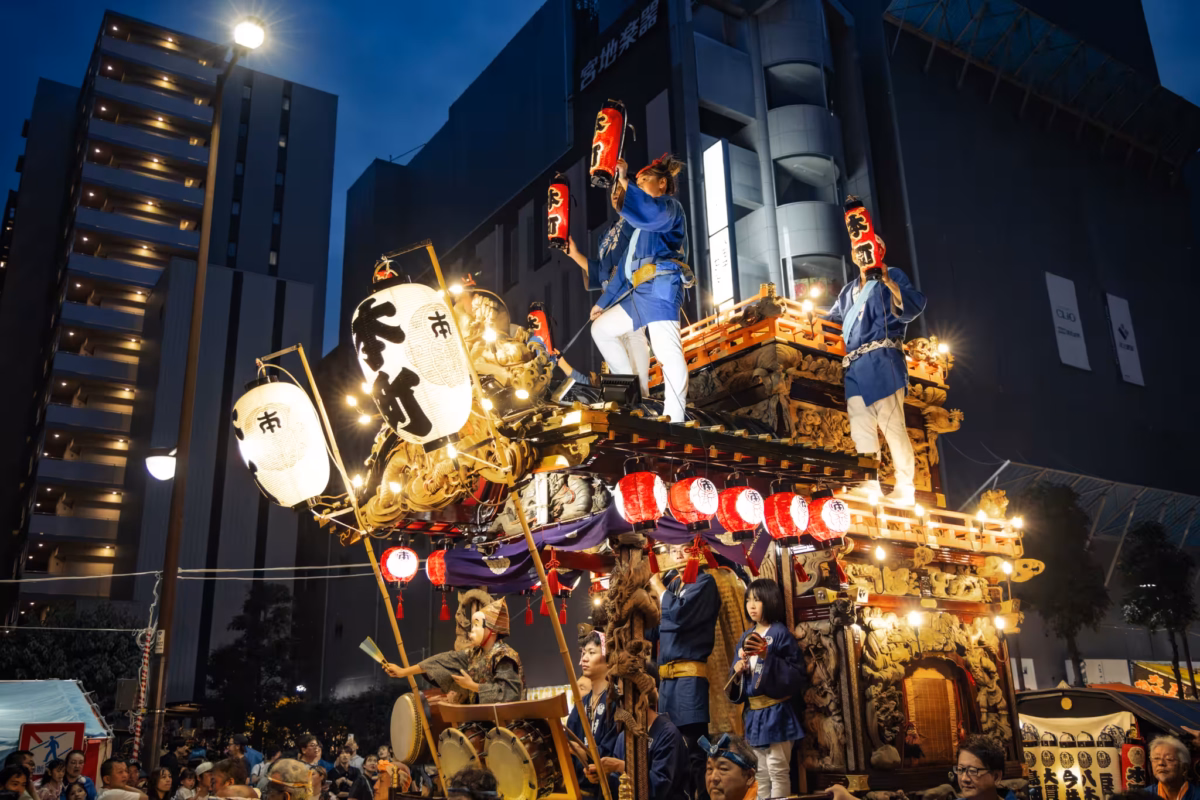 People on a bright dashi at Hachioji Matsuri.