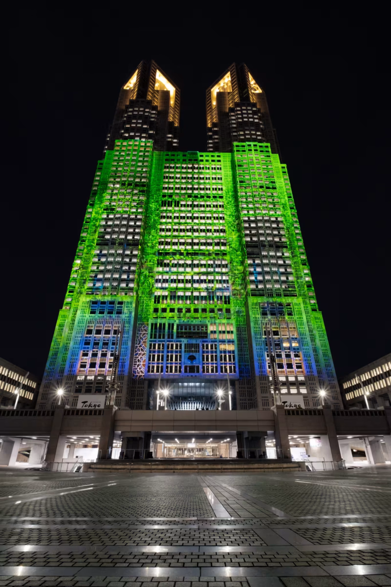 The Tokyo Metropolitan Government Building projection mapped in green.