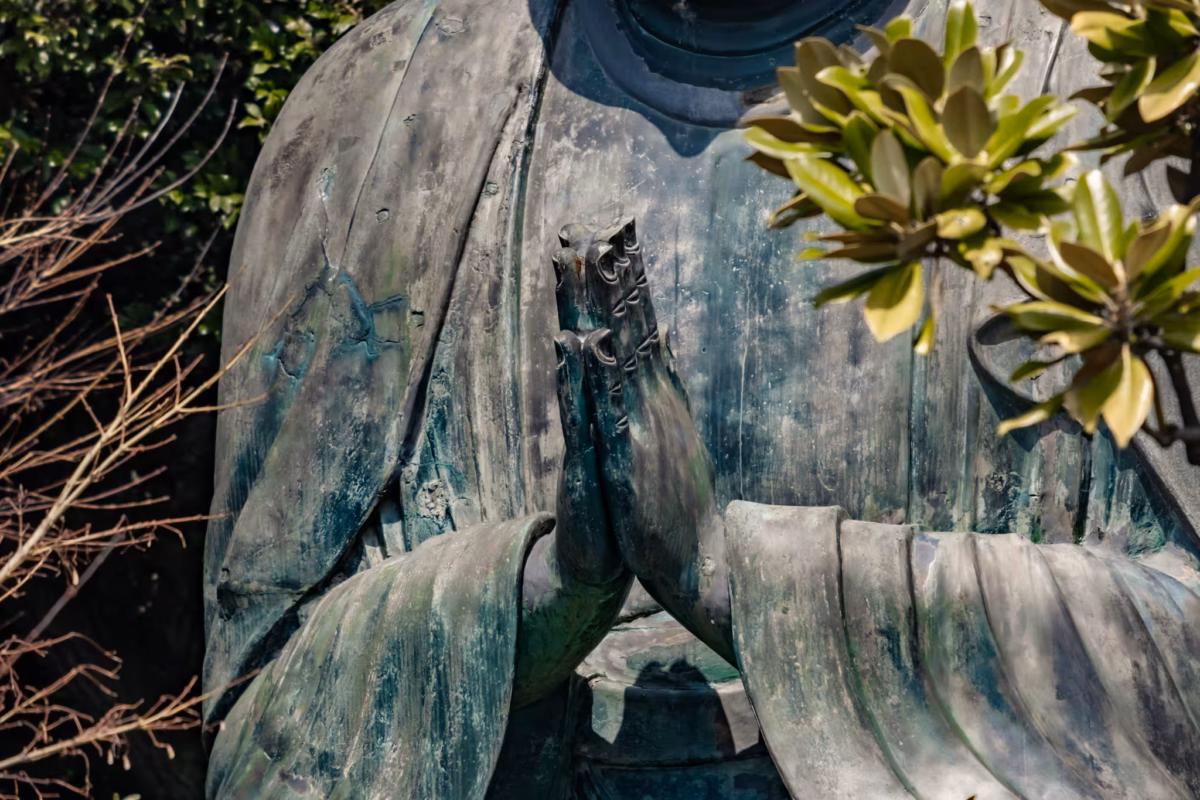 The Tennoji Big Buddha hands in a prayer pose.