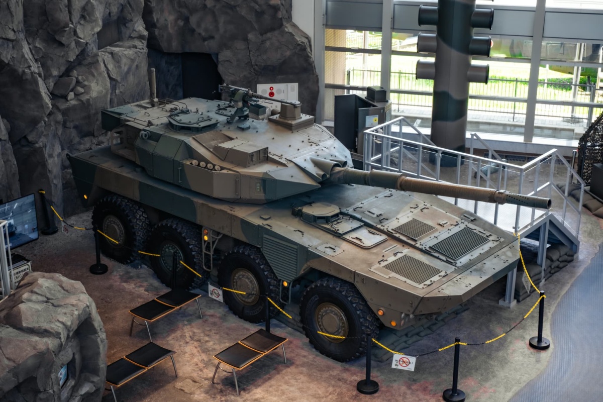 A Type 16 Maneuver Combat vehicle inside a building.