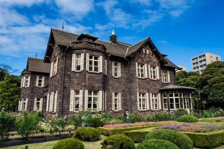 The mansion at Kyu-Furukawa Gardens under a blue sky.