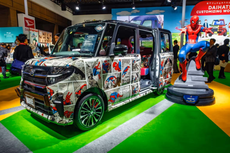 Spider-Man comic-wrapped Daihatsu van and matching statue at Tokyo Auto Salon 2020.