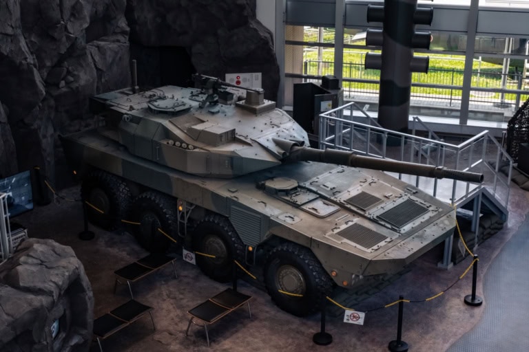 A Type 16 Maneuver Combat vehicle inside a building