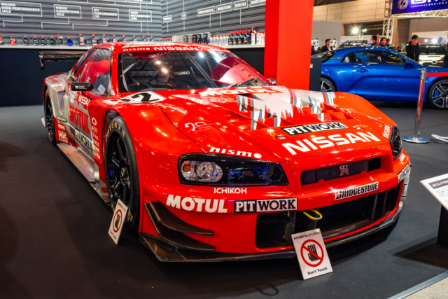 Red Motul Nissan GT-R race car featuring professional racing decals at Tokyo Auto Salon 2020.
