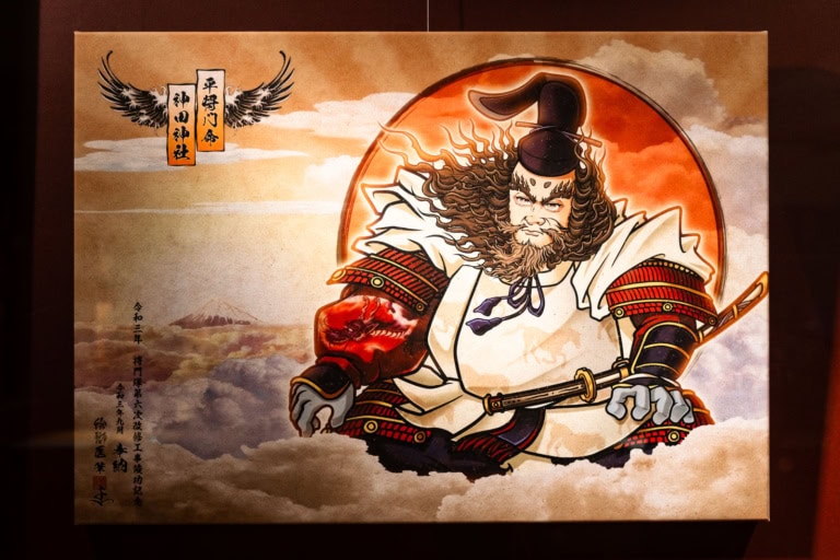 Bujin-ga of a samurai in red armor with a sword, set against a red sun and Mount Fuji amidst the clouds.