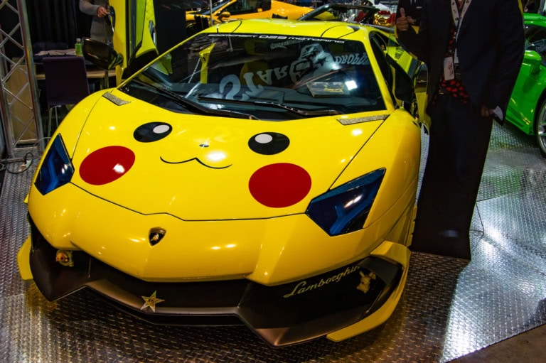 Pikachu-themed yellow Lamborghini Aventador with blue headlights at Tokyo Auto Salon 2017.