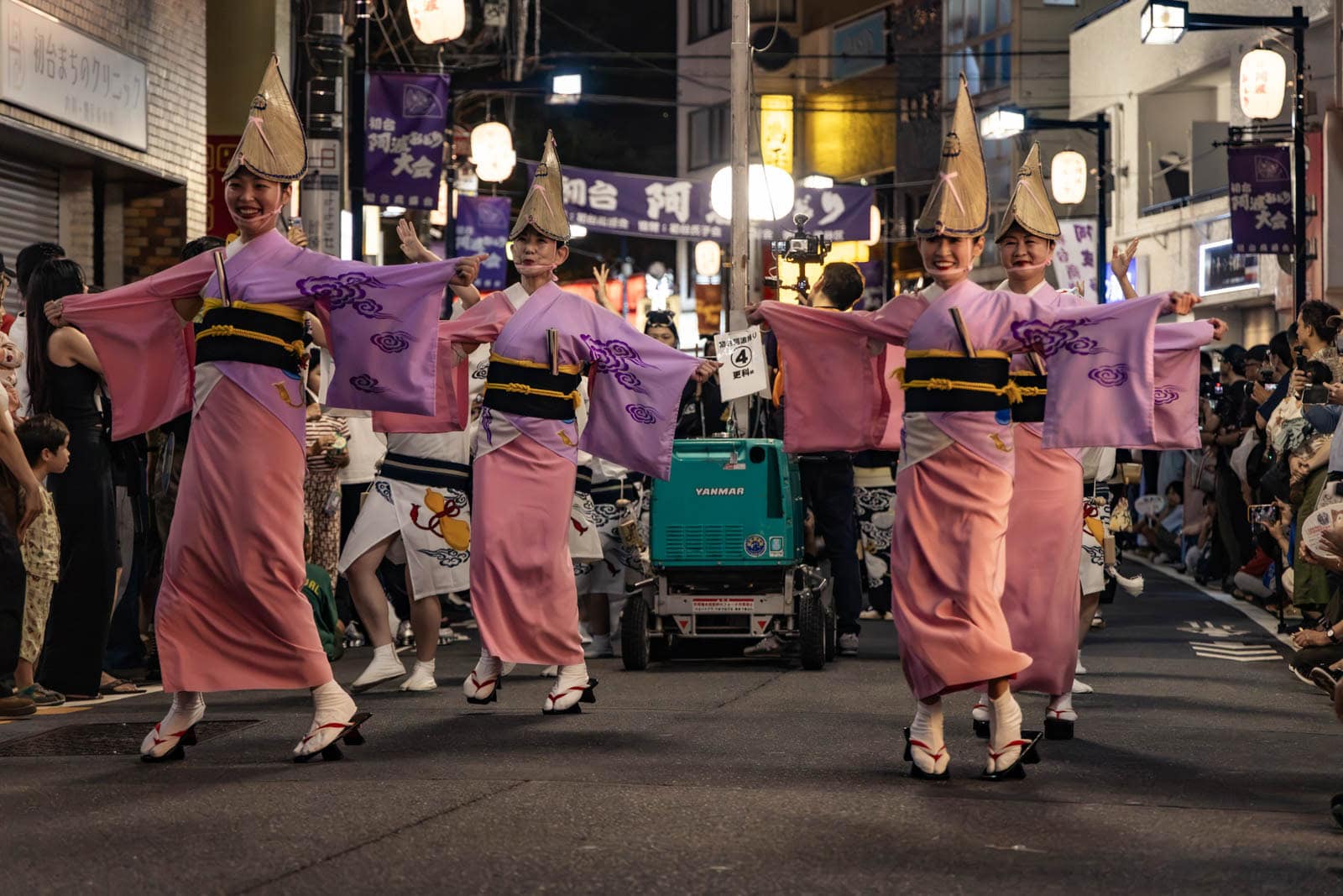 Dancers in pink kimonos and conical hats perform at the Hatsudai Awa Odori.