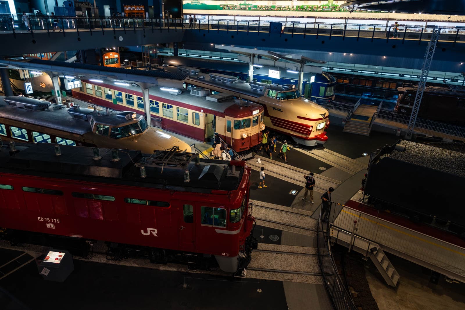 An overhead view of multiple historic trains on display at The Railway Museum.