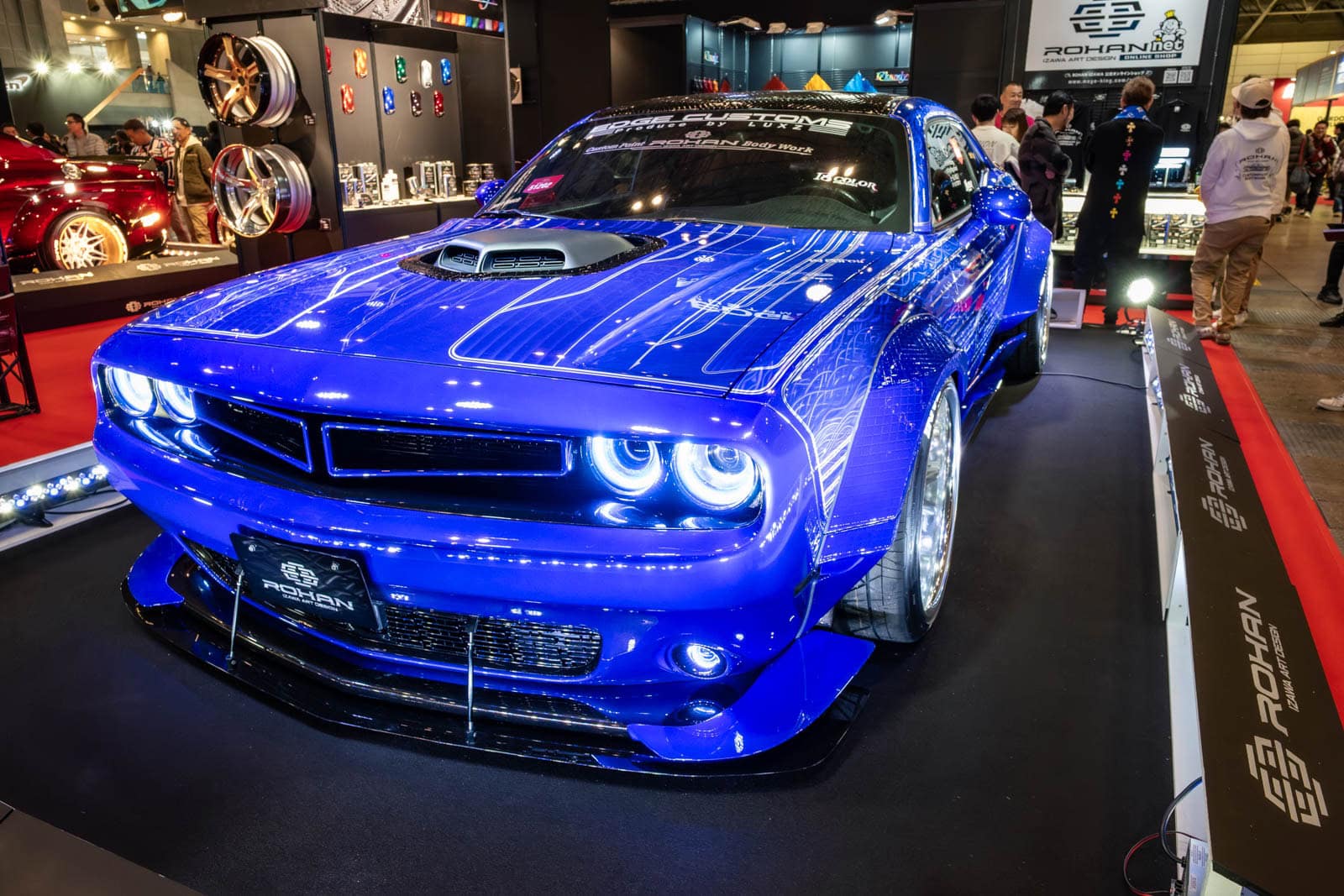 Rohan Bodyworks Dodge Challenger at Tokyo Auto Salon 2020, shown with background display racks and attendees.
