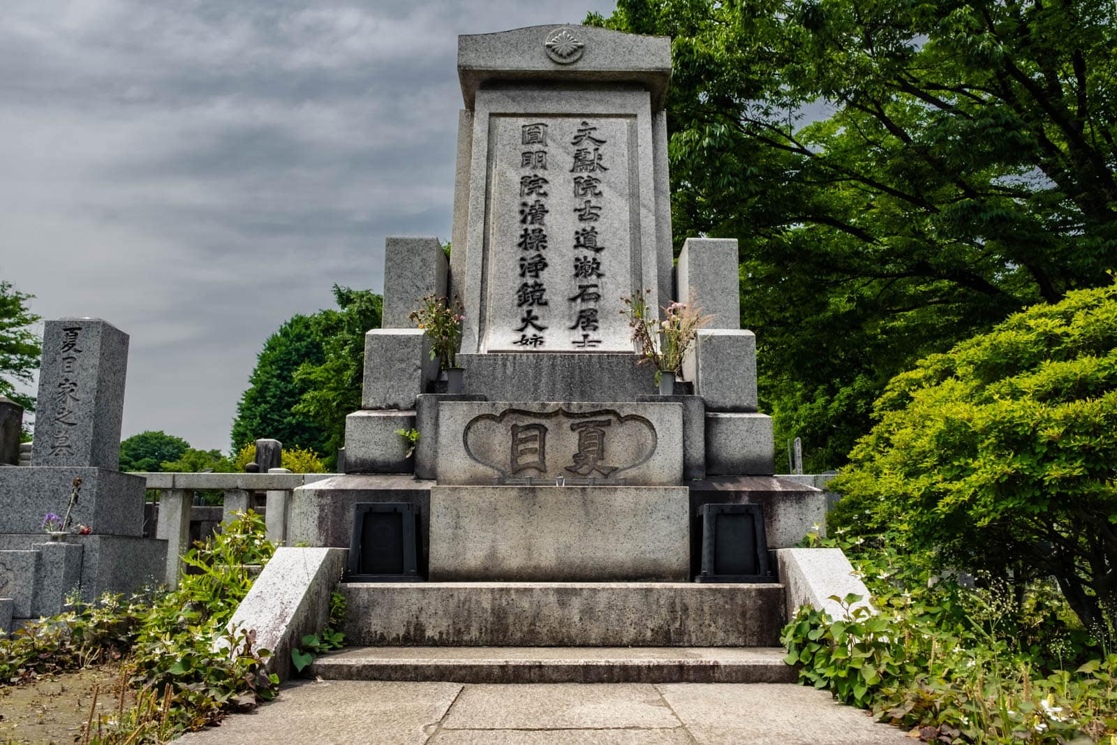 The armchair-shaped stone tombstone of author Natsume Soseki at Zoshigaya Cemetery in Tokyo.
